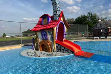 Little House with Slide in Zero-Depth Wading Pool